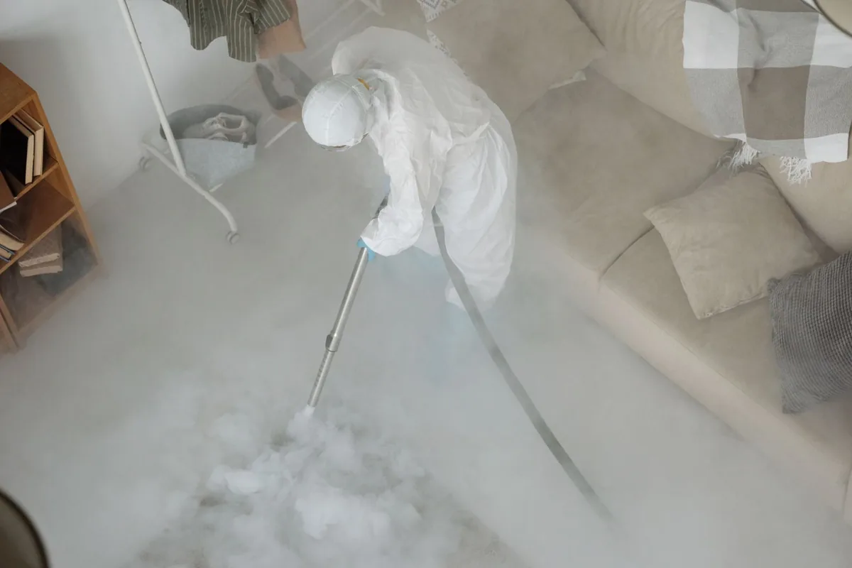 Biohazard cleanup technician in protective equipment, Gleneagle, CO